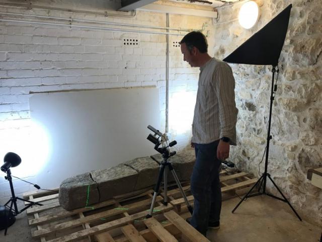 Archaeologist Tom Goskar carrying out close-range laser scanning on the stone. Archaeologist Tom Goskar carrying out close-range laser scanning on the stone.